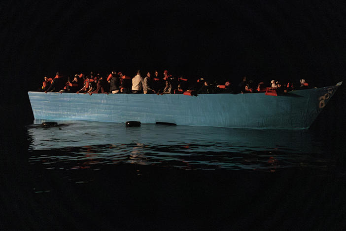 A wooden boat was spotted at night in international waters north of Libya by Doctors Without Borders' rescue team aboard the MV Geo Barents.