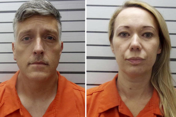 Booking photos provided by the Muskogee County, Okla., Sheriff's Office shows Jon Hallford and Carie Hallford, owners of Return to Nature Funeral Home, a Colorado funeral home where 190 decaying bodies were found.