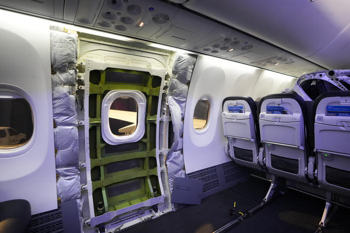 The door plug area of an Alaska Airlines Boeing 737 Max 9 aircraft, seen with the paneling removed, awaits inspection Wednesday at the airline's facilities at Seattle-Tacoma International Airport in SeaTac, Wash.