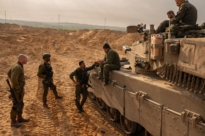 Israeli soldiers and artillery in southern Israel by the border with the Gaza Strip, on Dec. 27.