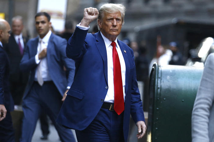 Former US President Donald Trump departs after speaking to the press after attending the civil fraud trial against the Trump Organization in New York State Supreme Court, in New York City on January 11, 2024.