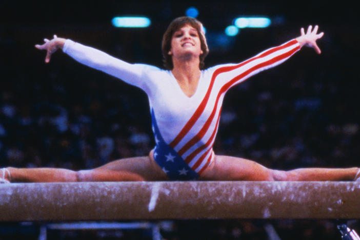 Mary Lou Retton performs on the balance beam in the 1984 Olympics in Los Angeles. Last week, she said she couldn't afford health insurance and owes big hospital bills after a serious illness.
