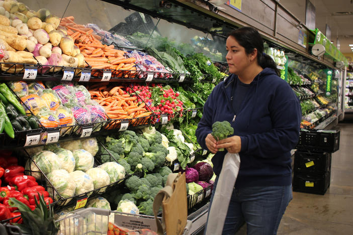 Maribel Martinez shops the produce section at King Sooper's in Boulder, Colo., the day after picking up her Fruit & Veg coupons.