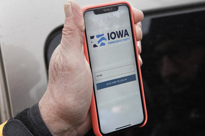 A precinct captain displays the Iowa Democratic Party caucus reporting app on his phone on Feb. 4, 2020. The app's technical difficulties marred Democrats' 2020 Iowa caucuses.