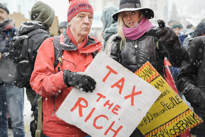 A demonstration at the annual meeting of the World Economic Forum in Davos, Switzerland, in 2023. A perennial Davos topic is how to improve the lives of the world's poor.