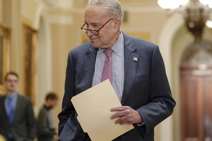 Sen. Majority Leader Chuck Schumer of N.Y., arrives to speak with reporters after a policy luncheon on Capitol Hill Tuesday, Jan. 9, 2024, in Washington.