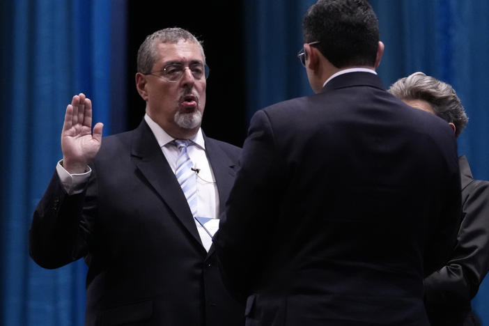 Incoming Guatemalan President Bernardo Arévalo takes the oath of office during his swearing-in ceremony in Guatemala City, early Monday, Jan. 15, 2024.