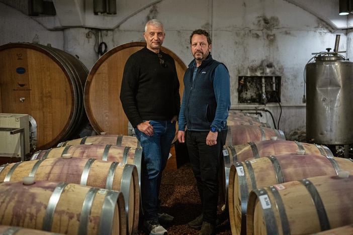 Golan Heights Winery CEO Assaf Ben Dov (left) and head winemaker Victor Schoenfeld are photographed in one of the winery's cellars in Katzrin, the Golan Heights, on Jan. 8, 2024.