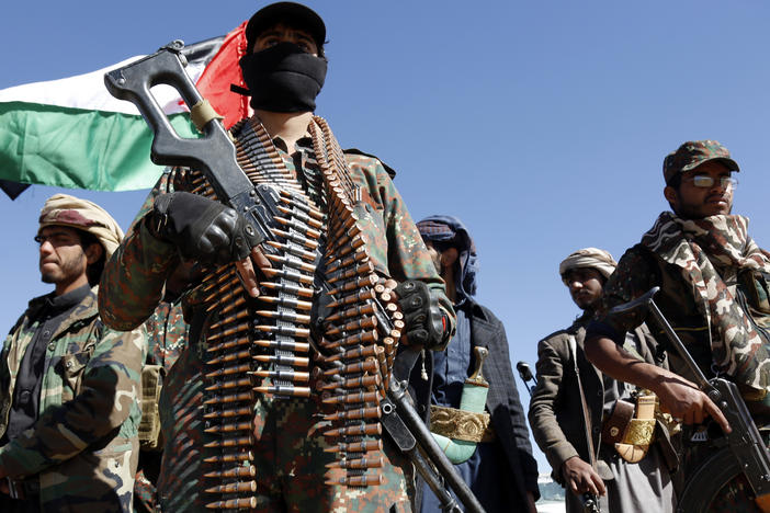Houthi fighters and tribesmen stage a rally against the U.S. and the U.K. strikes on Houthi-run military sites near Sanaa, Yemen, on Sunday, Jan. 14.