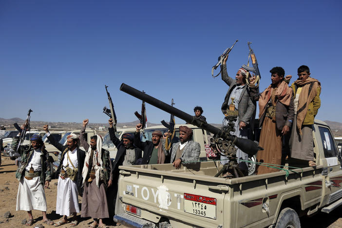 Houthi fighters and tribesmen stage a rally against U.S. and U.K. strikes on Houthi-run military sites near Sanaa, Yemen, on Sunday, Jan. 14, 2024.