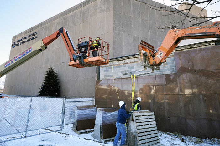 Workers begin demolition on  Wednesday at the Tree of Life building in Pittsburgh as part of the effort to reimagine the building to honor the 11 people who were killed there in 2018.