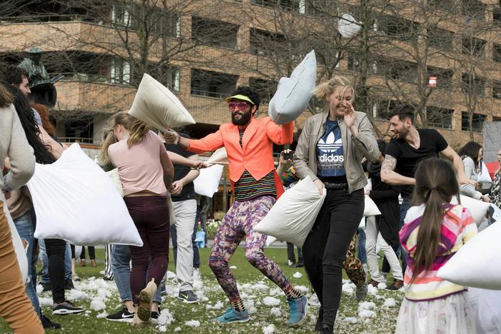 People take part in the annual International Pillow Fight Day in Rotterdam, Netherlands, in 2018.