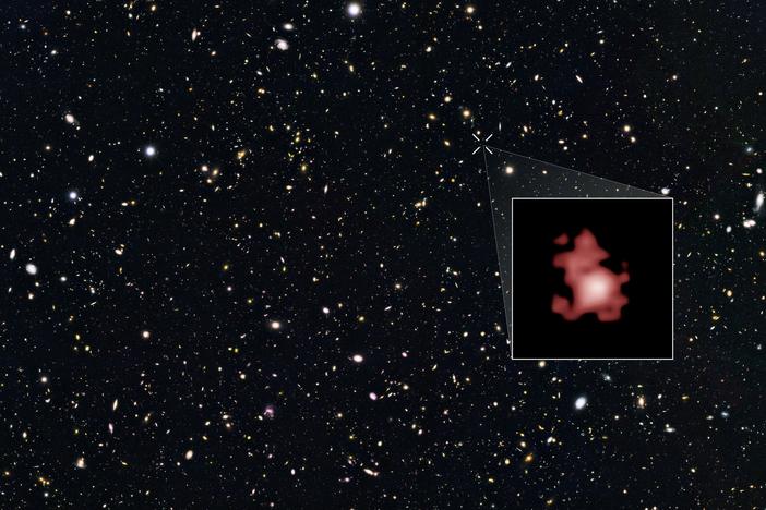 This image shows a 'close-up' of the galaxy GN-z11 as imaged by the Hubble Space Telescope, superimposed on top of another image marking the galaxy's location in the sky.