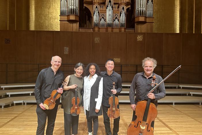 The Takács Quartet — left to right: Edward Dusinberre, Harumi Rhodes, Richard O'Neill and András Fejér — collaborated with composer Nokuthula Ngwenyama (center) to premiere her composition "Flow."