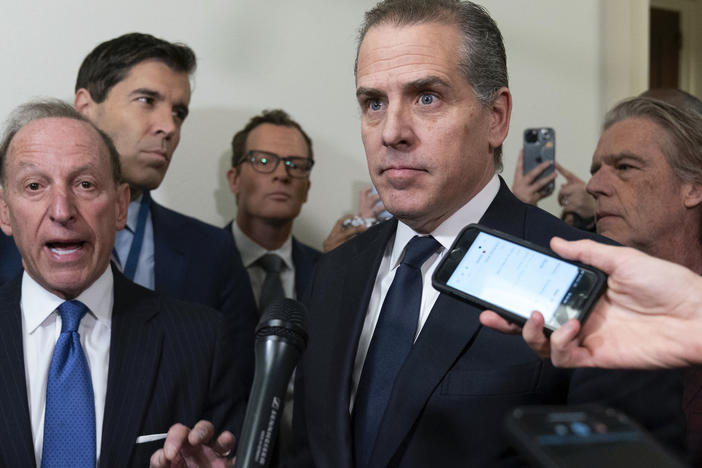 Hunter Biden, President Joe Biden's son, accompanied by his attorney Abbe Lowell, left, talks to reporters as they leave a House Oversight Committee hearing as Republicans are taking the first step toward holding him in contempt of Congress, Wednesday, Jan. 10, 2024, on Capitol Hill in Washington.