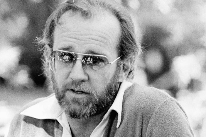 Comedian George Carlin appears at a news conference in 1978.