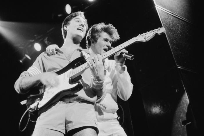 Andrew Ridgeley and George Michael of pop duo Wham! perform in London in November 1983.