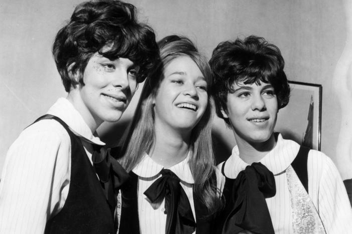 Three members of the Shangri-Las are seen on a visit to London in 1964, with Mary Weiss pictured in between twins Marge and Mary Anne Ganser.