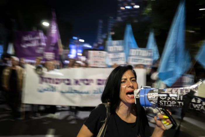 Protesters at a rare anti-war rally in Tel Aviv Thursday. The crowd was made up of people of all ages, many belonging to groups that have long called for an end to Israel's occupation of Palestinian territories.