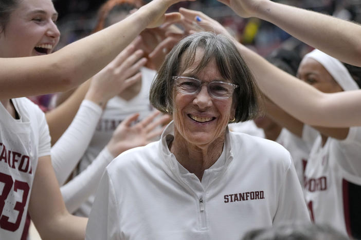 Stanford coach Tara VanDerveer smiles as players celebrate her 1,202nd victory as a college coach, against Oregon in an NCAA basketball game Friday, Jan. 19, 2024, in Stanford, Calif.