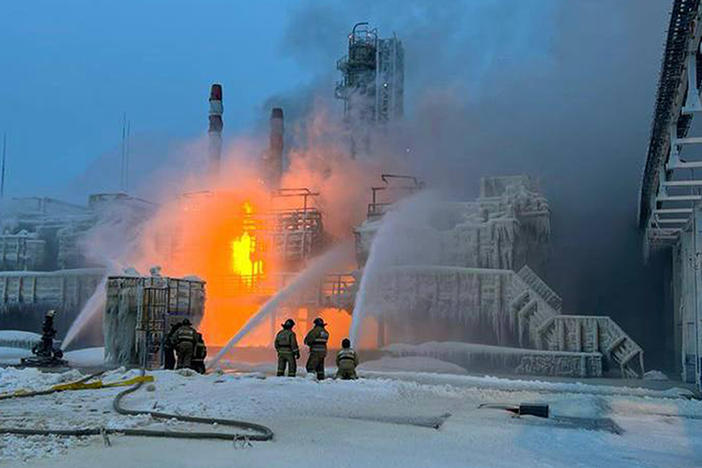 In this photo released by Telegram Channel of Leningrad Region Governor Alexander Drozdenko fire fighters extinguish the blaze at Russia's second-largest natural gas producer, Novatek in Ust-Luga port, 165 kilometers southwest of St. Petersburg, Russia, Sunday, Jan. 21, 2024. Local media reported that the port had been attacked by Ukrainian drones, causing a gas tank to explode.