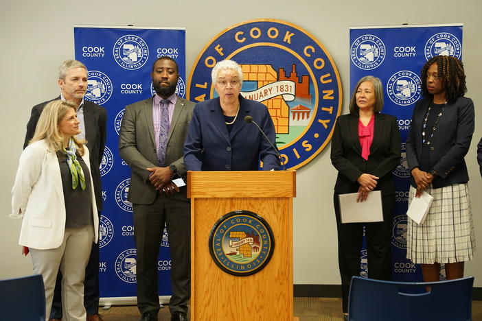Cook County board president Toni Preckwinkle (center) announces the county's debt relief program, along with executives from several local hospitals and Allison Sesso, President & CEO of RIP Medical Debt (far left).