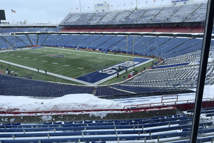 A few flurries fall at the stadium mostly-cleared of snow in Orchard Park, N.Y, ahead of the NFL football game between the Buffalo Bills and Kansas City Chiefs on Sunday.