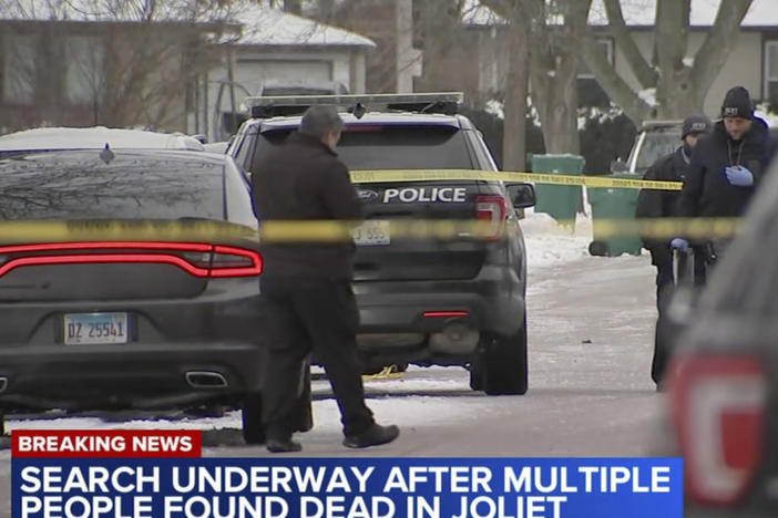 In this frame grab from video provided by WLS-TV ABC 7 Chicago, authorities work a scene in Joliet, Ill., on Monday, Jan. 22, 2024, after discovering eight people shot and killed at three locations since Sunday in the Chicago suburbs.