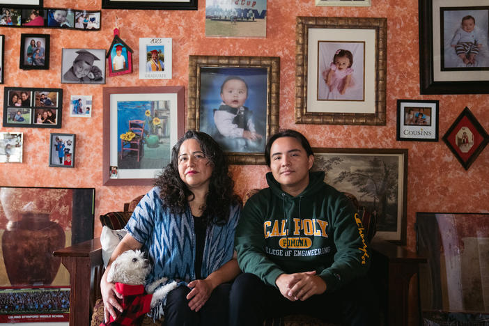 Myrna Aguilar and her son, David Thornton, pose for a portrait at their home in Los Angeles. Thornton applied for a pell grant last year, but did not qualify this academic year even though their income hasn't changed.