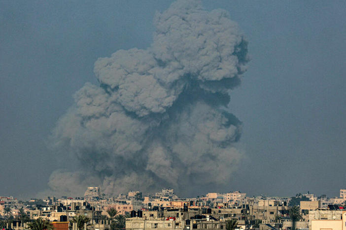 A picture taken from Rafah shows smoke billowing over Khan Younis in the southern Gaza Strip during Israeli bombardment on January 19, 2024, amid ongoing battles between Israel and the Palestinian militant group Hamas. (Photo by AFP) (Photo by -/AFP via Getty Images)