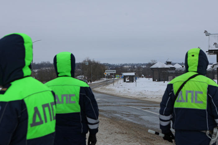 Traffic police officers block off a road near the crash site of the Russian Ilyushin Il-76 military transport plane outside the village of Yablonovo in Russia's Belgorod region on Wednesday.