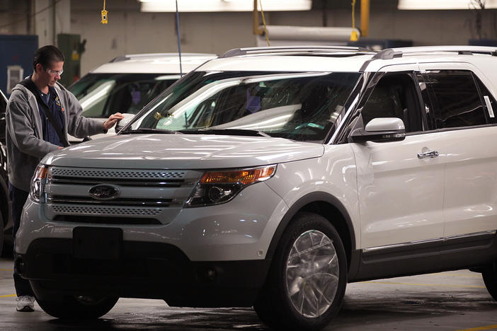 A worker assembles a 2011 Ford Explorer at the Chicago Assembly Plant in 2010 in Chicago. Ford is recalling nearly 1.9 million Explorers in the 2011-2019 model years over a piece of trim that can detach from the vehicles.