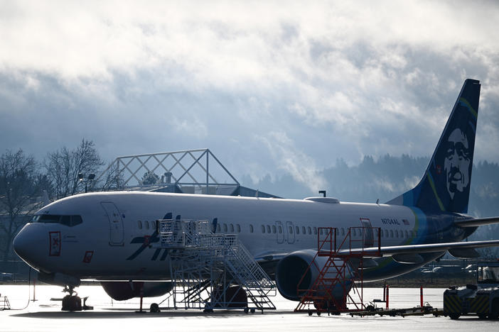 Alaska Airlines N704AL, a Boeing 737 Max 9, which made an emergency landing at Portland International Airport on January 5 is parked at a maintenance hanger in Portland, Ore. on January 23, 2024. One of two door plugs on the emergency exit door blew out shortly after the plane took off from Portland.