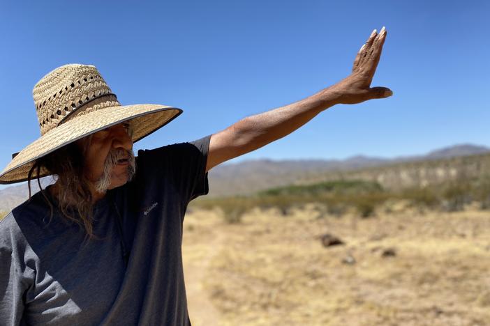 In western Arizona, Ivan Bender, a Hualapai tribal member, points to an area, bordering Hualapai land, where an Australian mining company is exploring for lithium - a key metal in electric vehicle batteries.