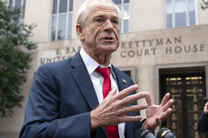 Former Trump White House official Peter Navarro talks to the media as he arrives at U.S. Federal Courthouse in Washington on Thursday.
