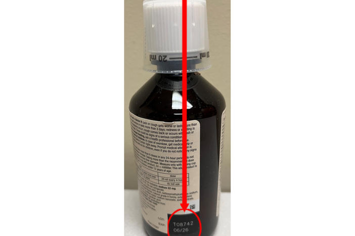 This photo provided by U.S. Food & Drug Administration shows the location of a lot number of recalled Robitussin cough syrup. The maker is recalling several lots of its medicine Thursday, due to contamination that could pose a serious risk to people with weakened immune systems.