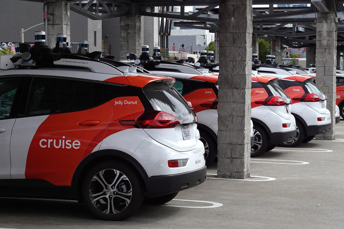 Cruise autonomous vehicles sit parked in a lot in June 2023 in San Francisco, Calif. The company's fleet of robotaxis have not been operating for the past few months, after the company's response to a crash in October raised concerns with regulators.