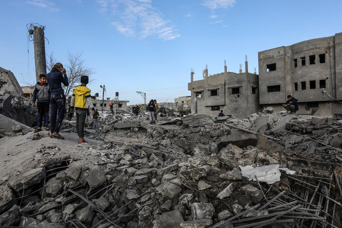 Palestinians inspect destruction after an Israeli bombing of Omar bin Abdul-Aziz Mosque in Rafah, Gaza Strip, on Thursday.