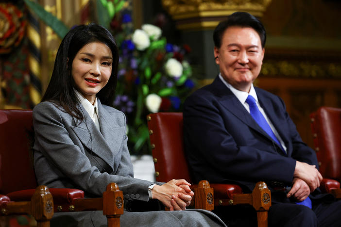 South Korea's President Yoon Suk Yeol sits with his wife Kim Keon Hee, after he addressed MPs in the Royal Gallery during a visit to the Palace of Westminster on Nov. 21, 2023 in London, England.
