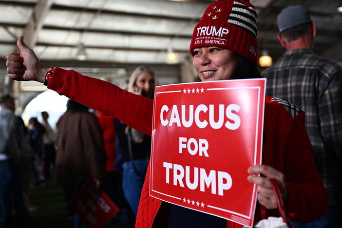 Supporters of former President Donald Trump arrive to hear him speak at a commit to caucus rally in Las Vegas on Saturday. The Nevada Republican Party is holding a caucus to determine who wins the state's GOP delegates — a contest that's two days after the state-run primary.
