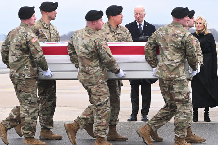 President Biden and first lady Jill Biden attend the dignified transfer of the remains of three U.S. service members killed in a drone attack on a U.S. military outpost in Jordan, at Dover Air Force Base in Delaware on Friday.