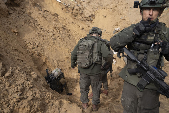 Israeli troops enter a Hamas tunnel underneath a cemetery in the southern Gaza city of Khan Younis on Jan. 27. Israel said Thursday that it had defeated Hamas in the city, the main battleground in recent days.
