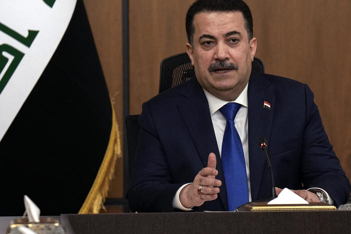 Iraqi Prime Minister Mohammed Shia al-Sudani chairs a meeting with top-ranking officials of the Iraqi armed forces and of the U.S.-led coalition about the future of American and other foreign troops in the country, in Baghdad on Jan. 27.