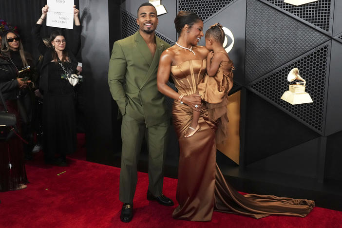 John Gaines, from left, Victoria Monét, and Hazel Monét Gaines arrive at the 66th annual Grammy Awards on Sunday, Feb. 4, 2024, in Los Angeles.