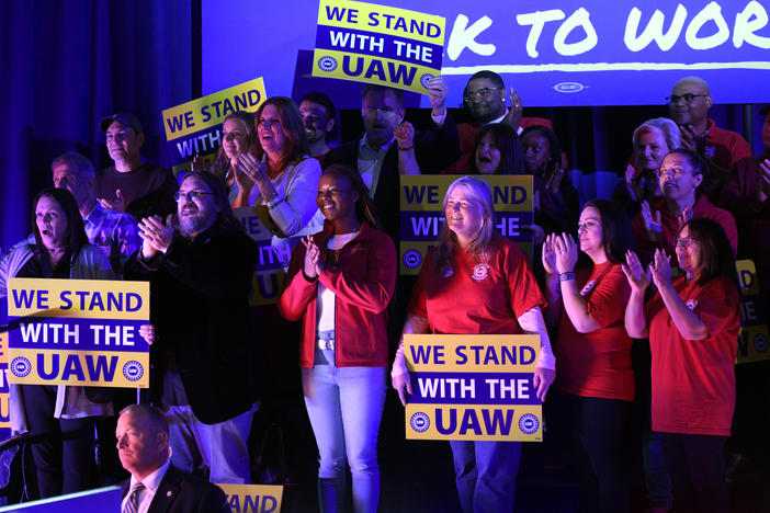 Union members listen as President Joe Biden speaks to United Auto Workers at the Community Building Complex of Boone County, on Nov. 9, in Belvidere, Ill.