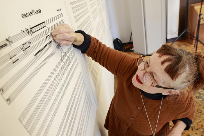 View of an embroidered sheet of music from the piece <em>Organ2/ASLSP</em> by John Cage. Artist Sabine Groschup expands the embroidery with each change of sound. After two years, the sound of the slowest piece of music in the world, has changed for the 16th time. This means that the six-sound piece that has been played in the Burchardi Church since February 2022 has become a seven-sound piece.