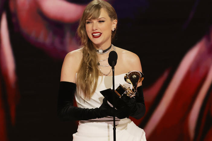 Taylor Swift accepts the best pop vocal album award for <em>Midnights</em> onstage during the 66th Grammy Awards.