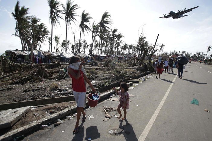 Residents of Tacloban in the central Philippines in 2013, after Typhoon Haiyan devastated the area. Scientists are renewing calls for a new Category 6 designation for the the most powerful hurricanes and typhoons, such as Haiyan.