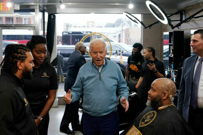President Biden greets staff and patrons at Regal Lounge, a Men's Barber & Spa, in Columbia, S.C., before speaking at a political event in the area on Jan. 27.