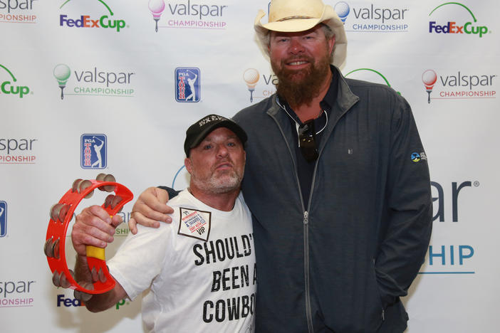 Tim McBride and Toby Keith at a VIP meet-and-greet before a concert in 2017.